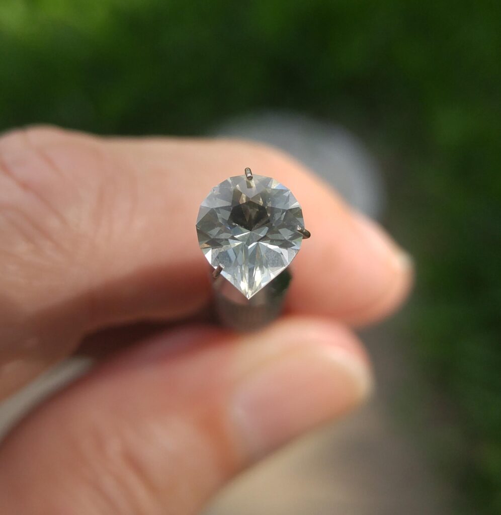 A Sunstone (Labradorite) cut as a Brilliant Pear (1.00 caret, 7 x 8.15 mm).