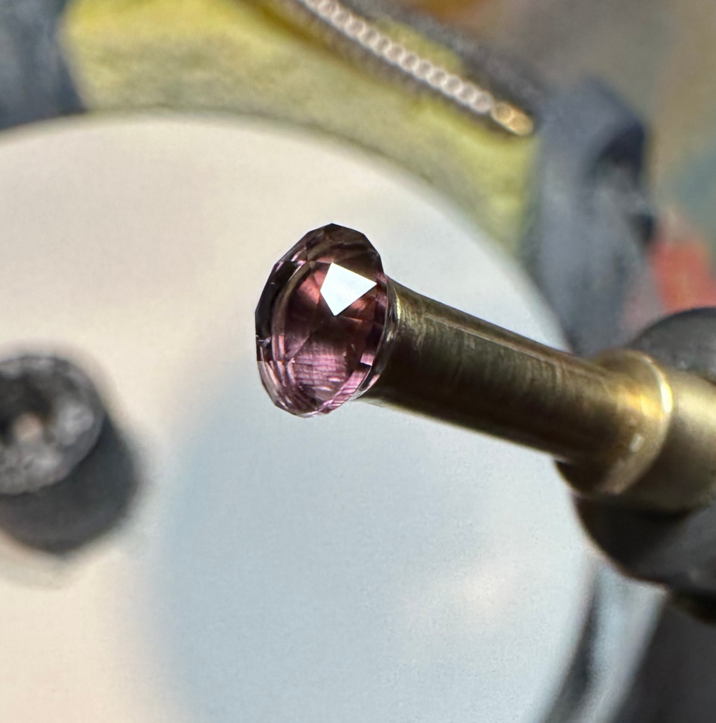 Amethyst Standard Round Brilliant, table completed and polished.