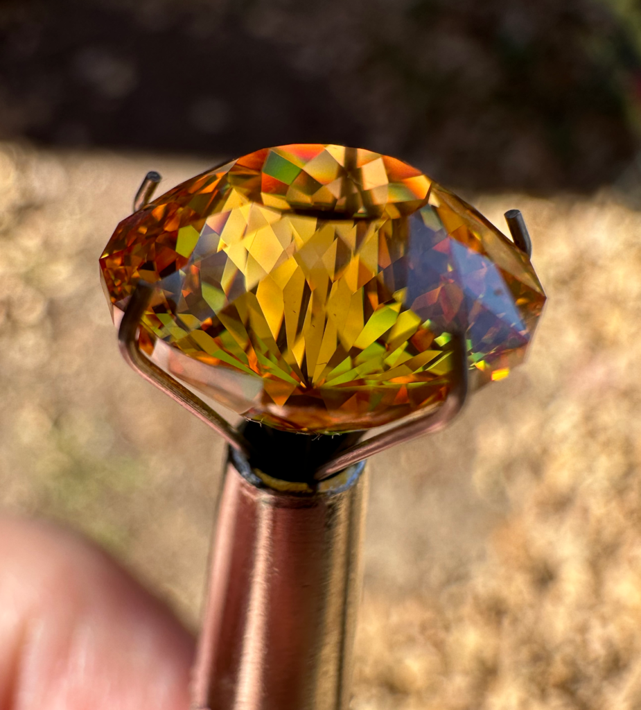 Yellow CZ cut in the Graham Portuguese design with 161 facets. The gem came in at 13.50 carats and 11.75 mm diameter.